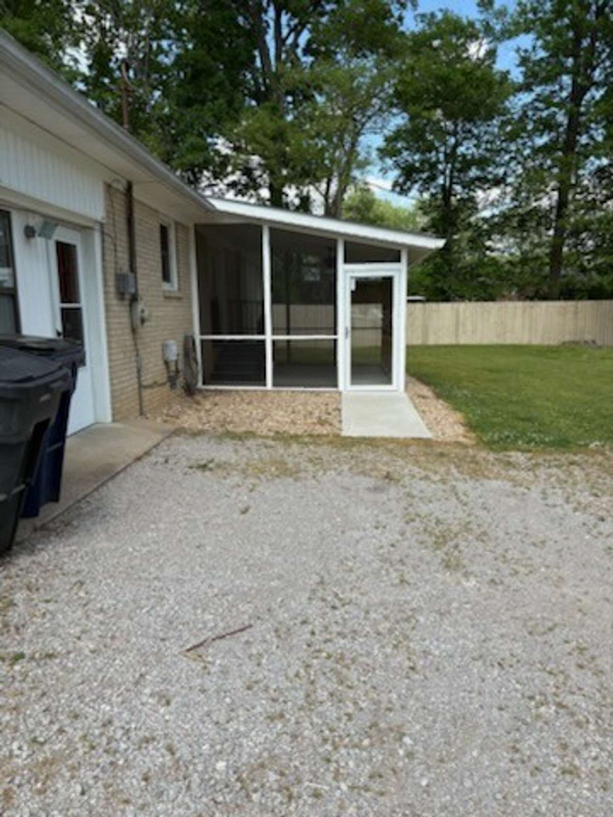 View of Screened Porch with huge partially fenced back yard