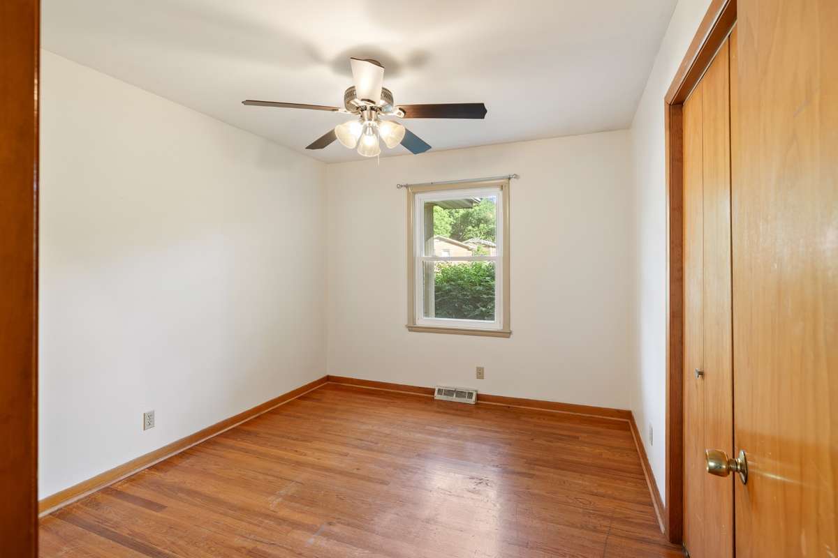 Bedroom #2 with real hardwood floors and large closet