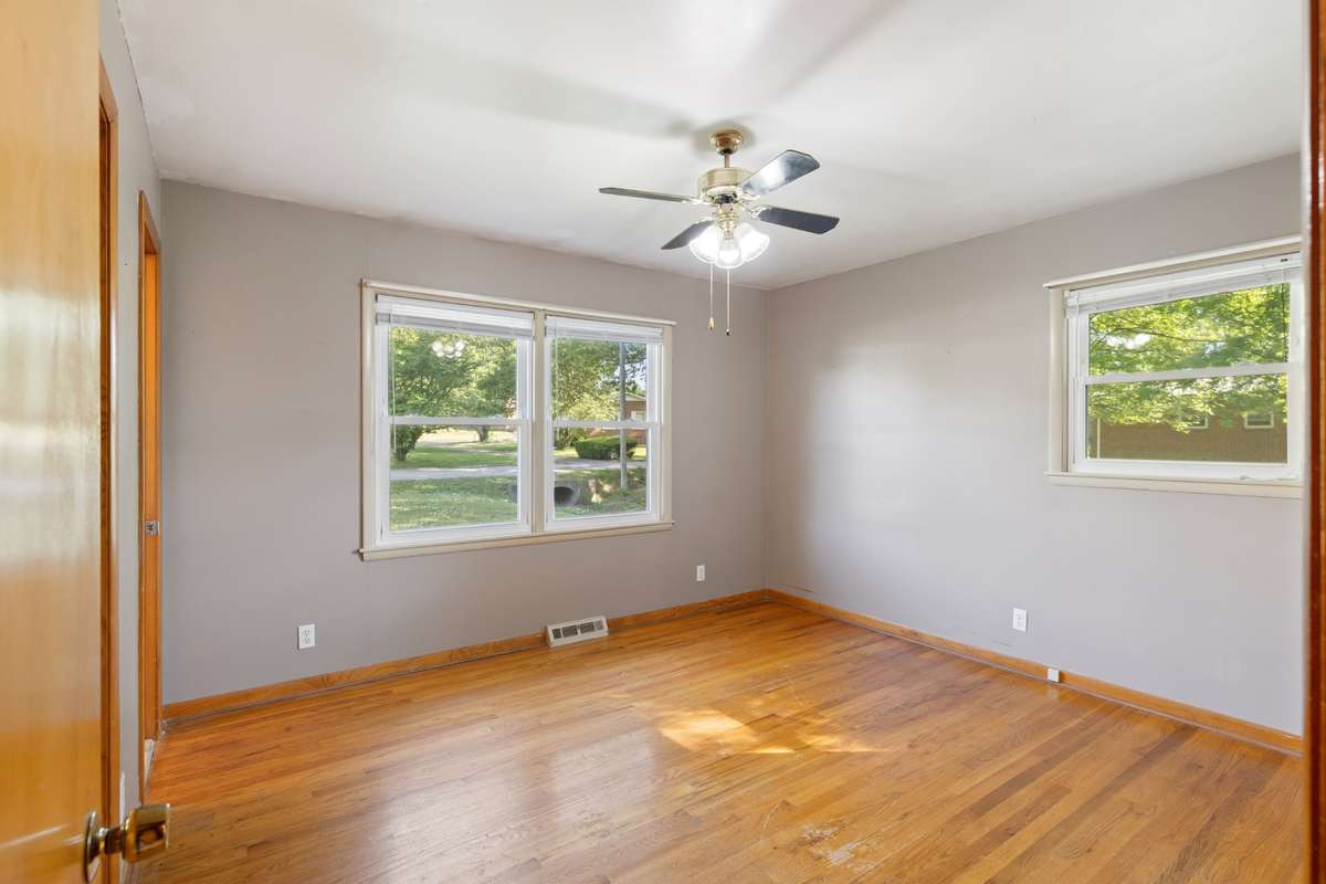 Master Bedroom with 1/2 Bath, Real Hardwood Floors and Ceiling Fan
