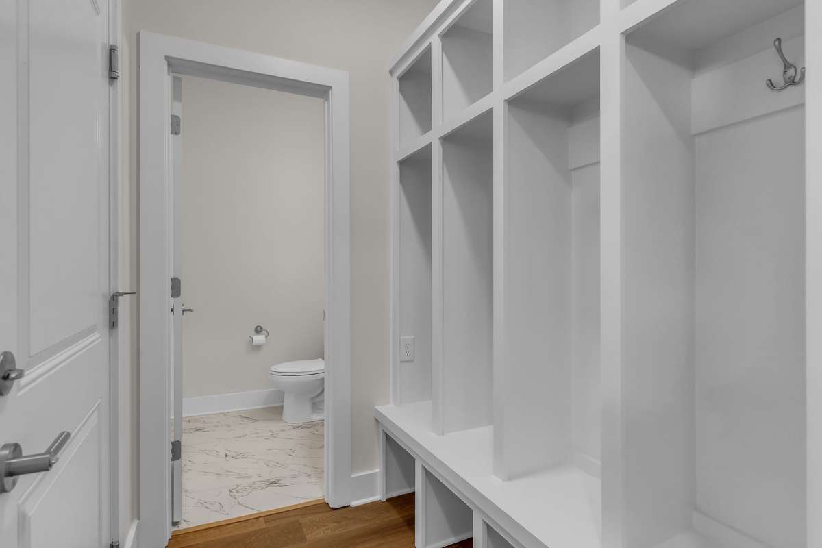 Custom drop station off the garage and beside the 1/2 bath.