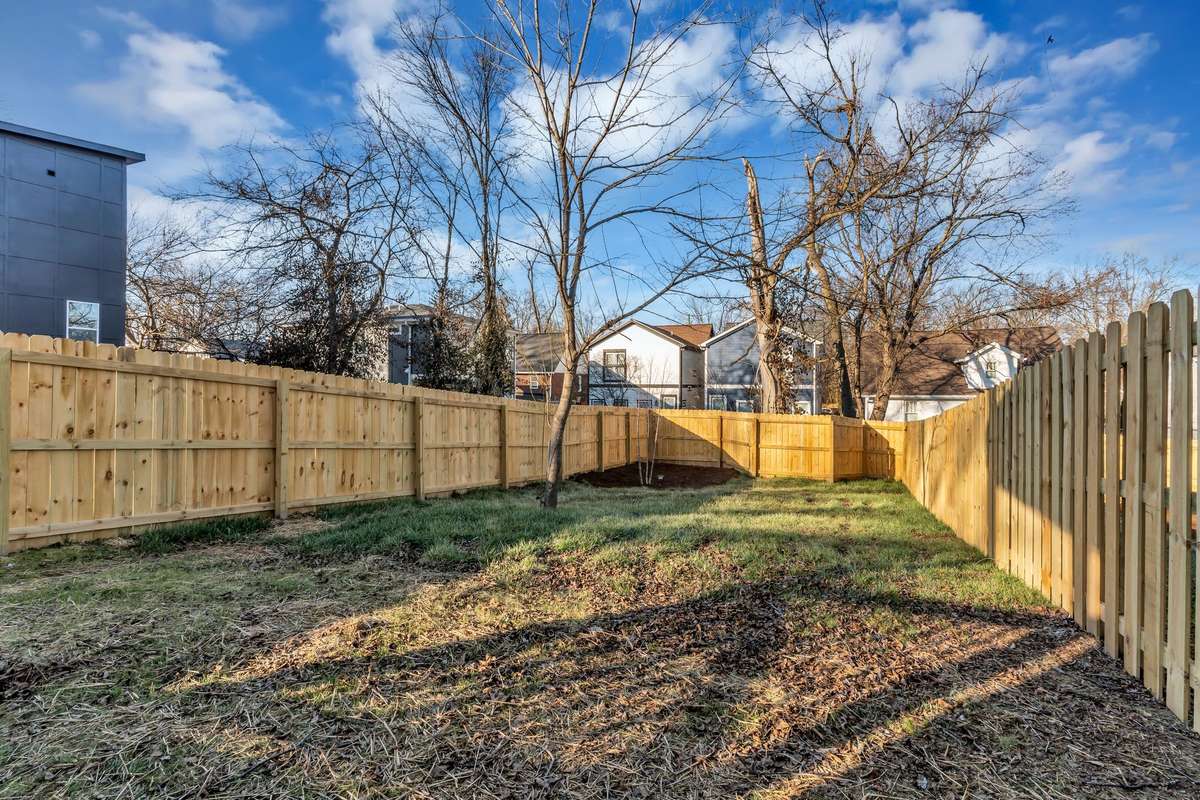 A level fenced backyard any pet or kiddos would love!
