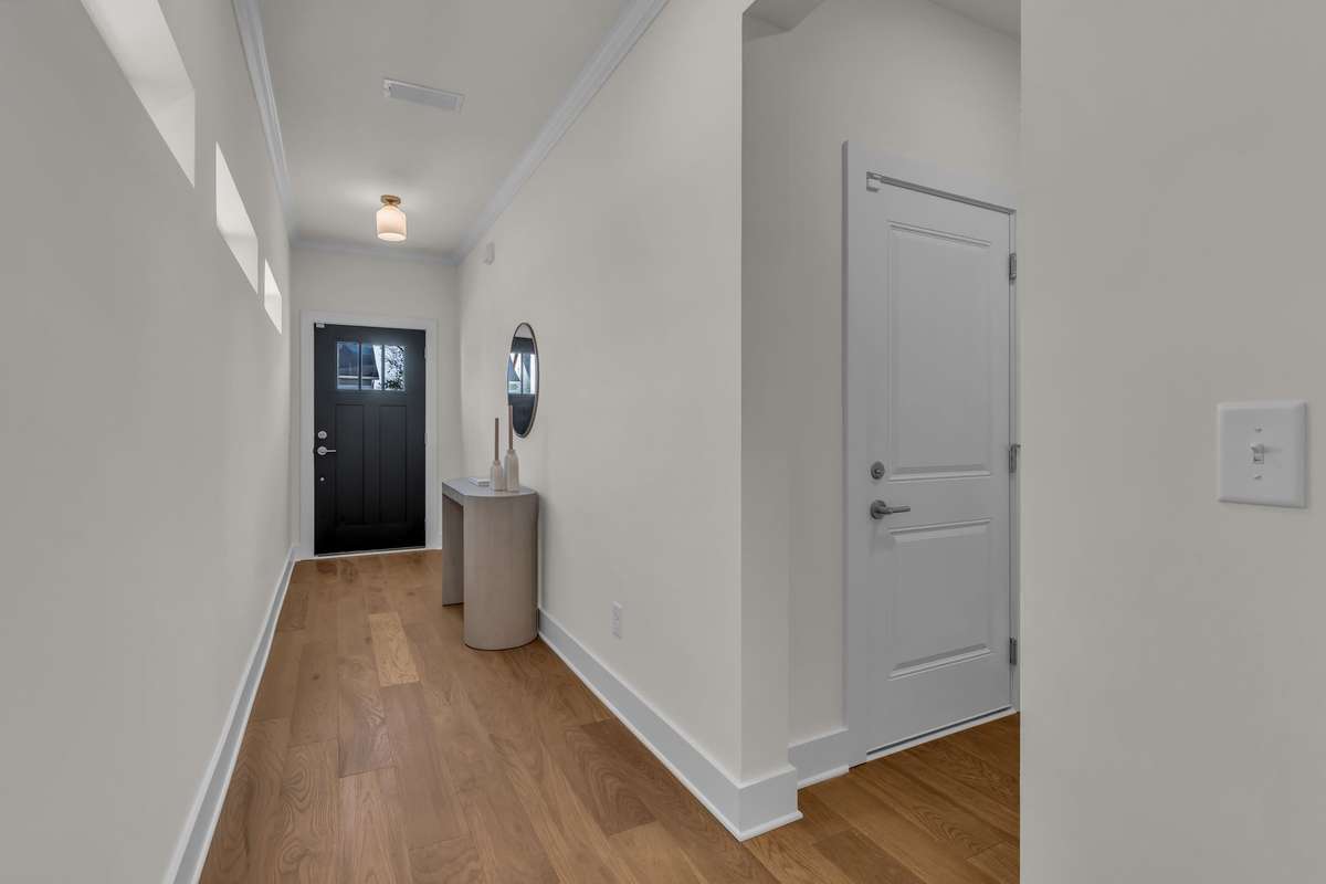 Large entrance hall with lots of wall space of incredible artwork.