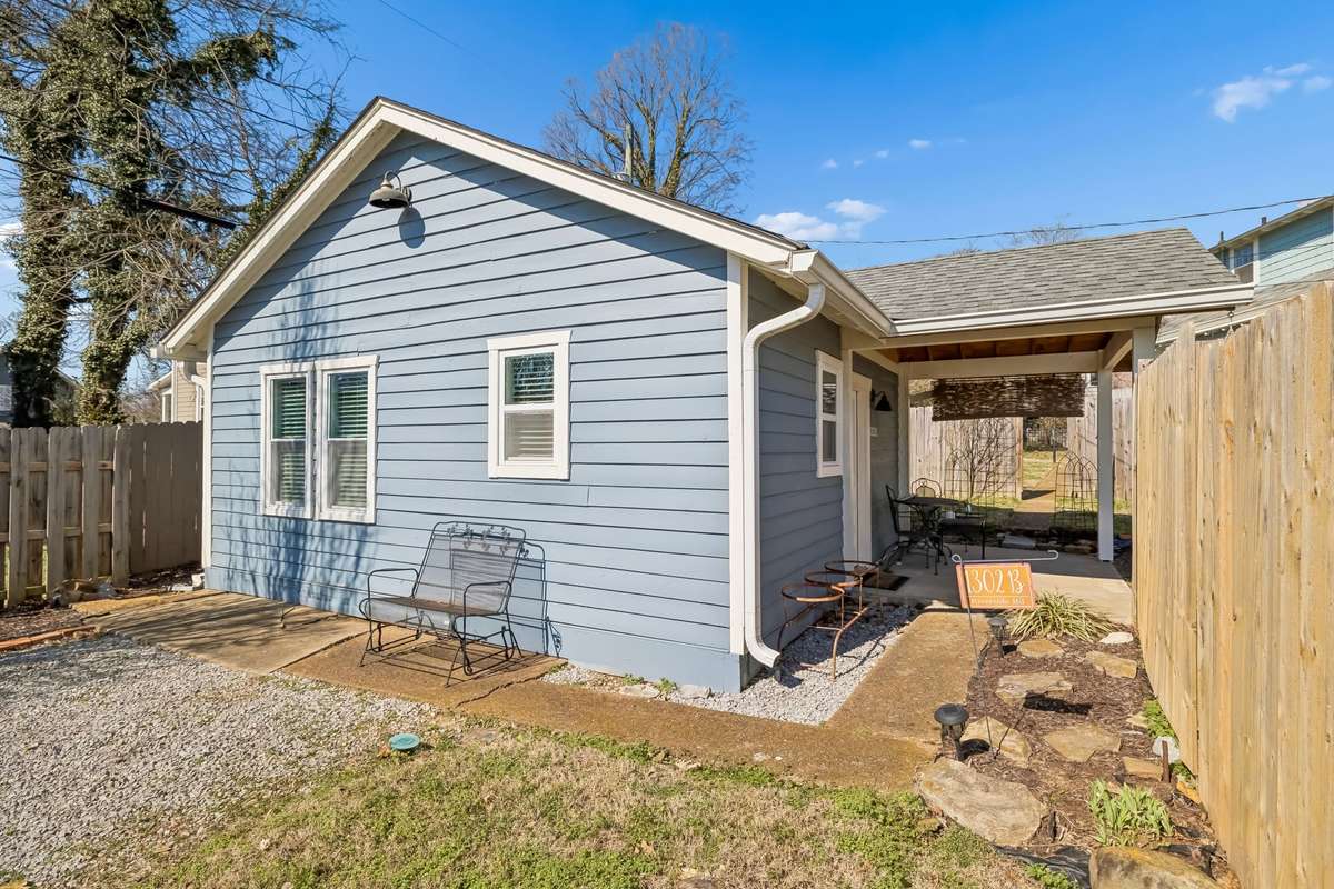detached apartment parking with privacy fence giving guests privacy
