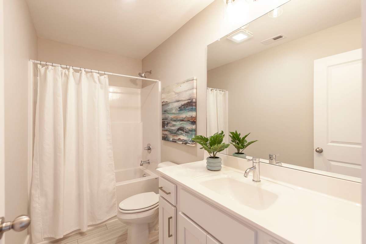 The guest bath is a nice size and bright white as well.