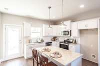 This kitchen is very spacious with great natural light.