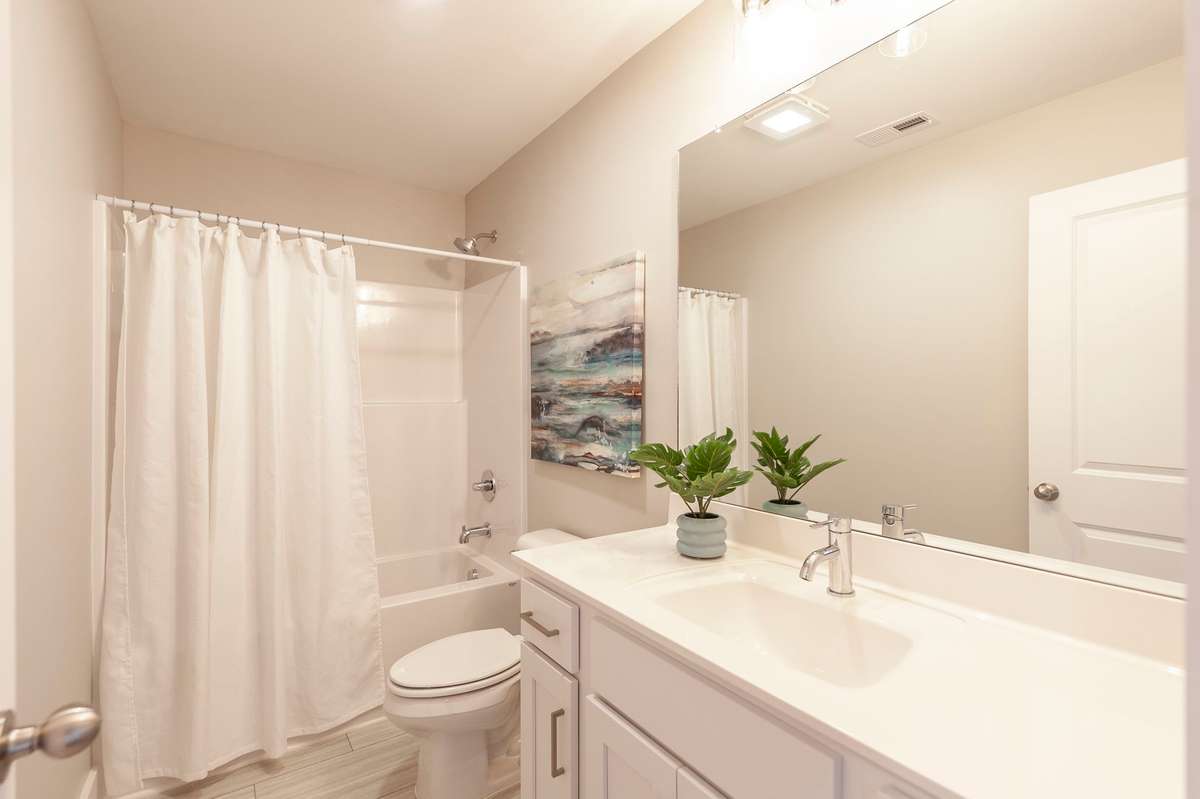 The guest bath is a nice size and bright white as well.