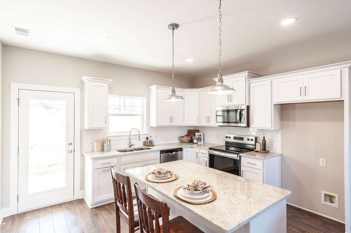 This kitchen is very spacious with great natural light.