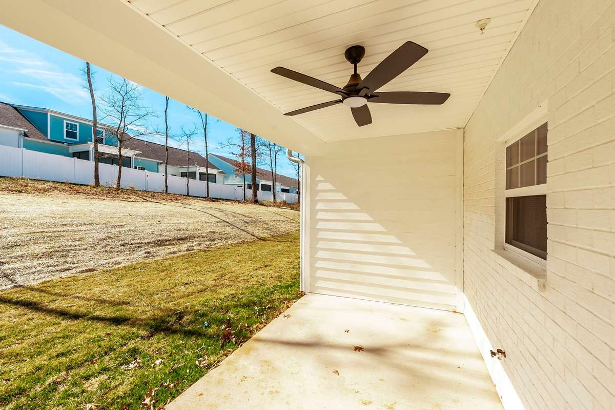 Stepping out back you'll see the covered patio area,