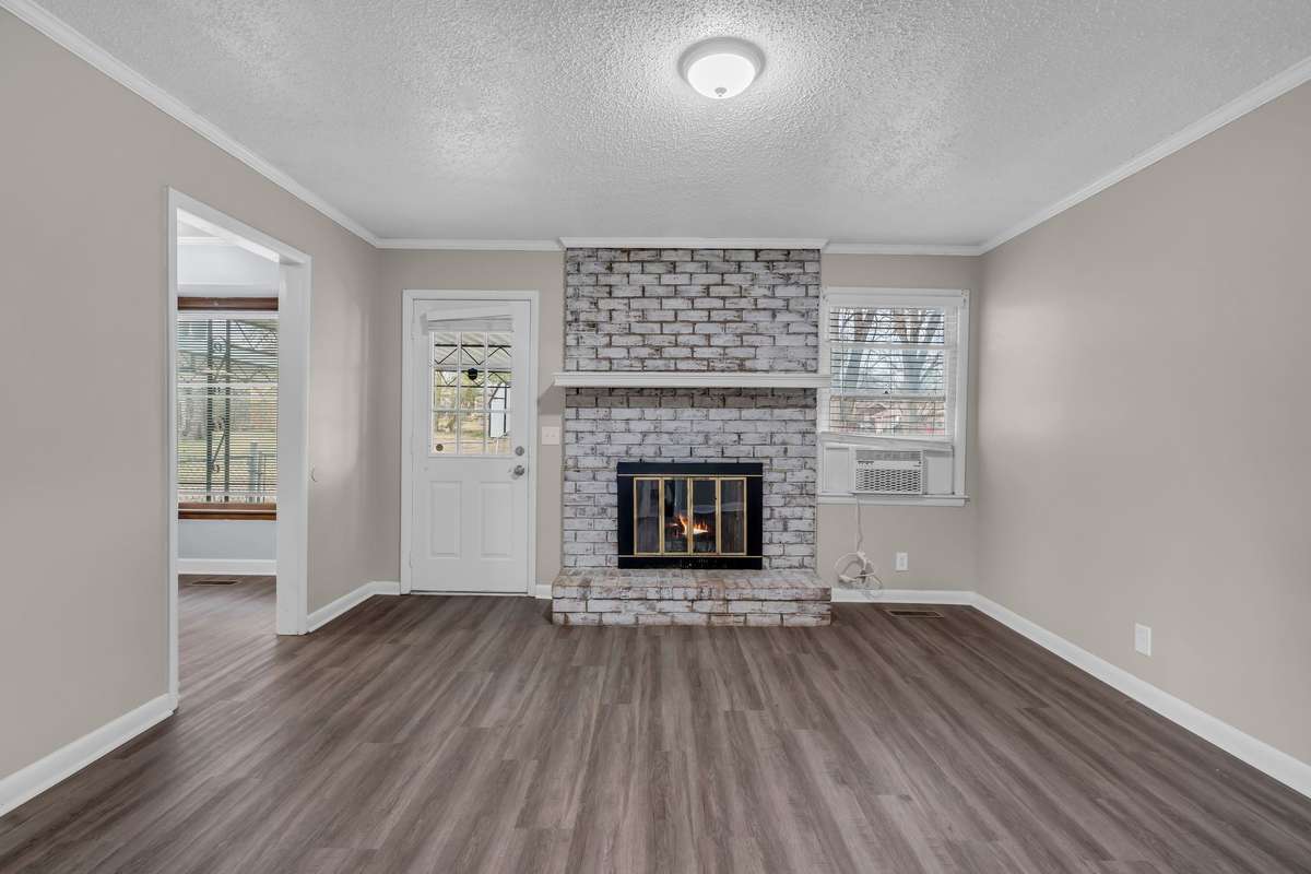 Den with fireplace or use for cozy dining room