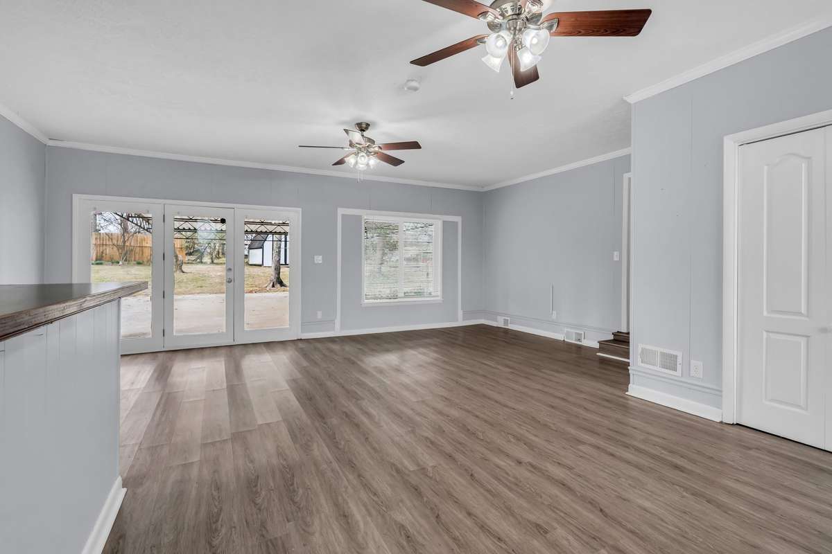 Oversized bonus room with access to the back yard and covered porch