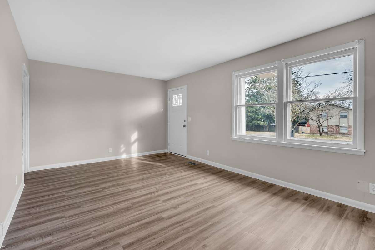 Living room overlooking the level front yard.  All new flooring and paint throughout