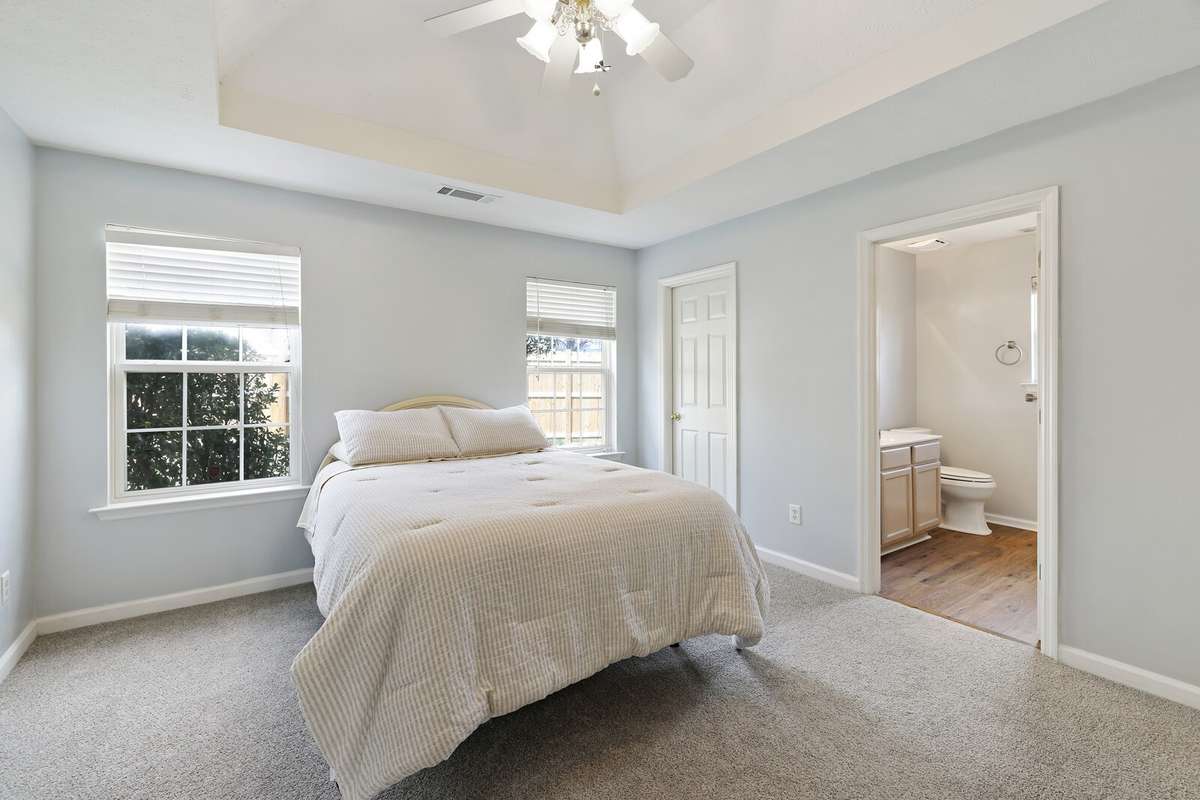 Primary bedroom with trey ceiling