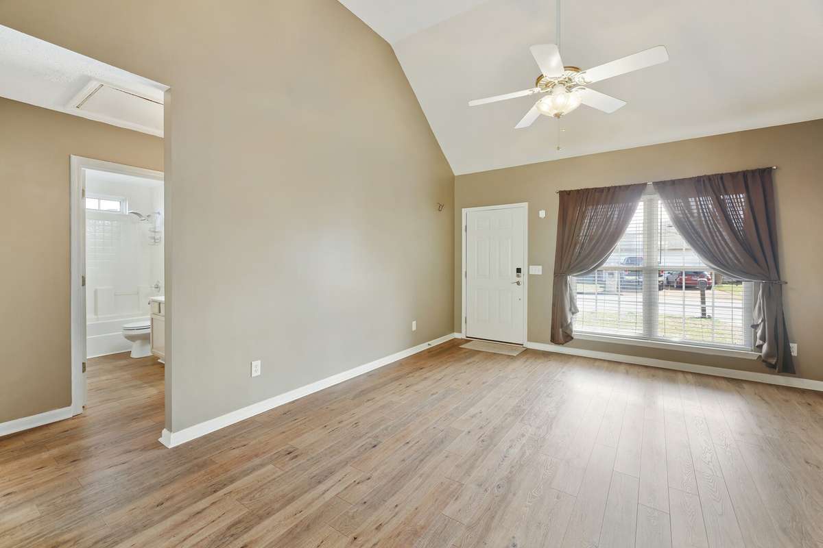Vinyl plank throughout living, dining, and kitchen
