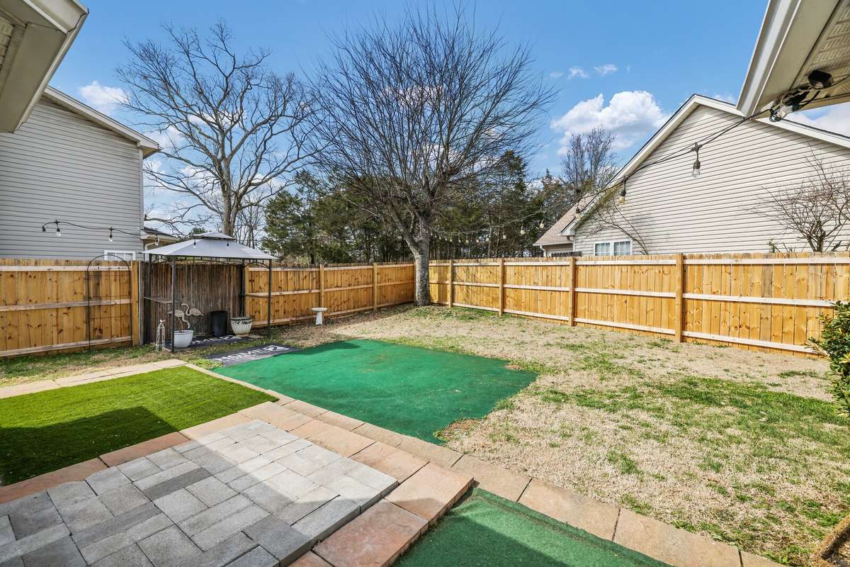 Backyard with new wooden privacy fence