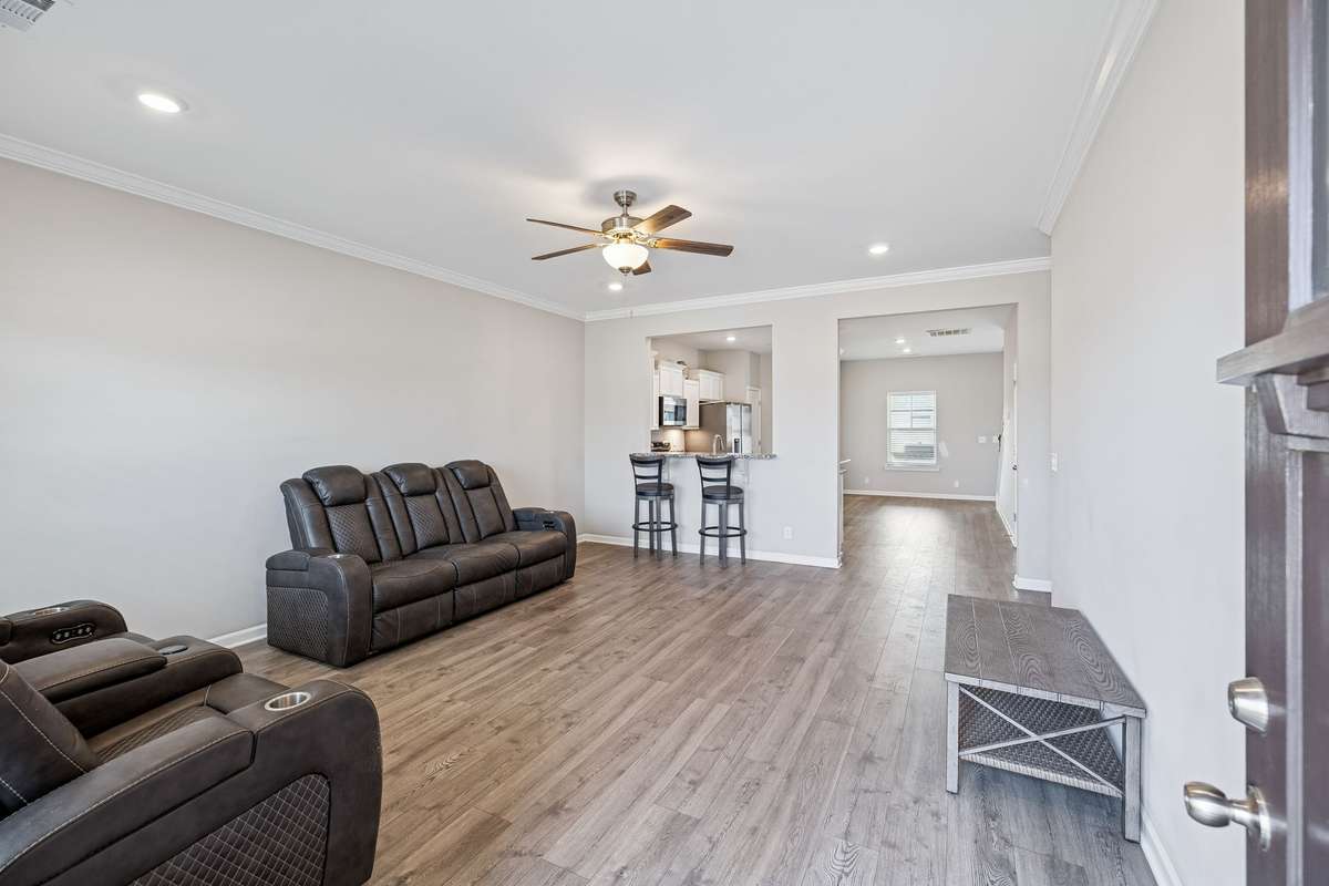 Roomy living area has a ton of natural light in addition to the recessed lighting and fan! 501 Ruby Cate Way, Murfreesboro, TN 37128