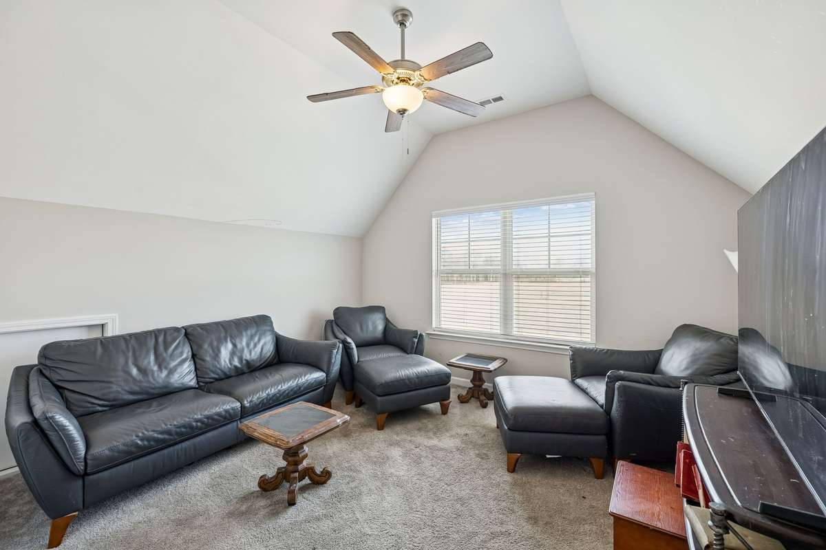 Flex space over garage features a vaulted ceiling with fan and oversized window for natural light! 501 Ruby Cate Way, Murfreesboro, TN 37128
