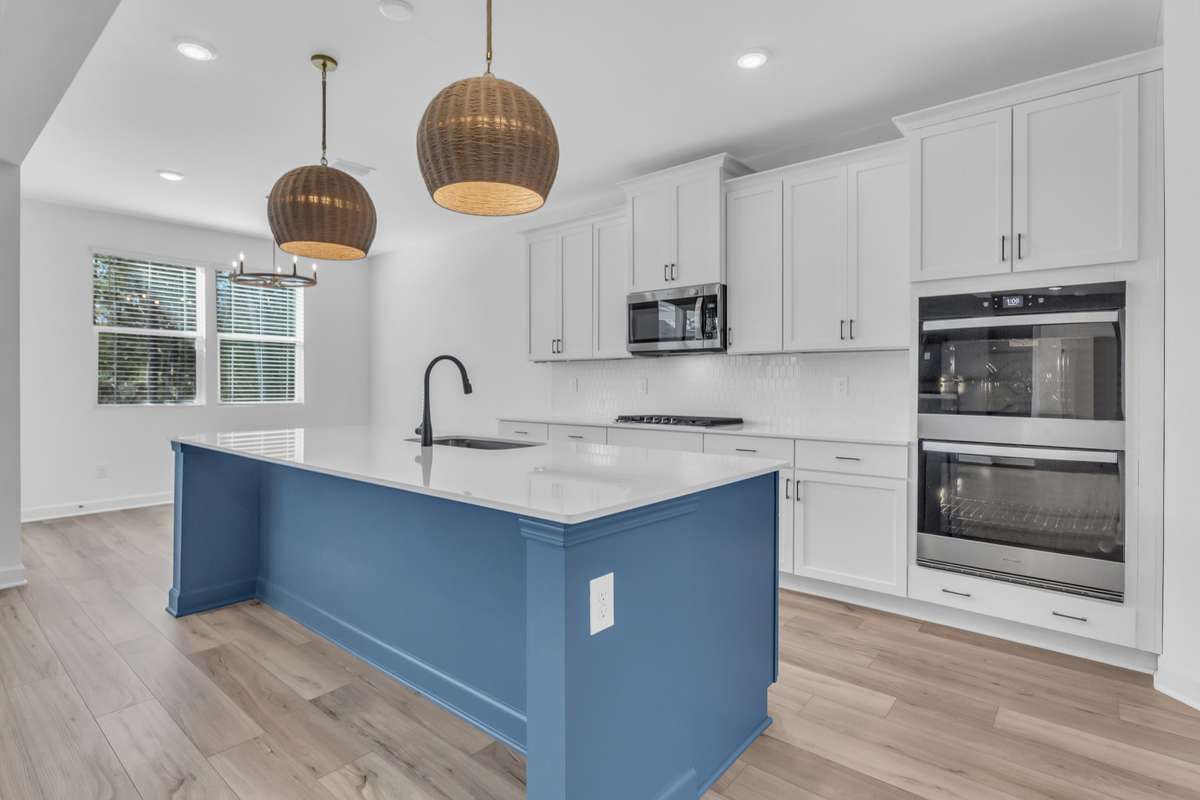 Beautiful lighting, ample cabinet space, walk in pantry and and room for a table and chairs by in the sunny breakfast nook.