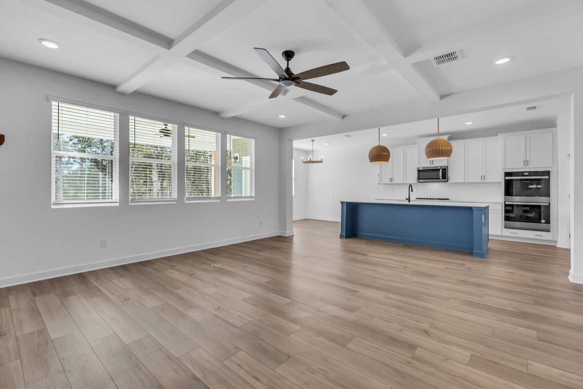 Expansive Living space with fireplace opens to the kitchen. Ideal for entertaining.