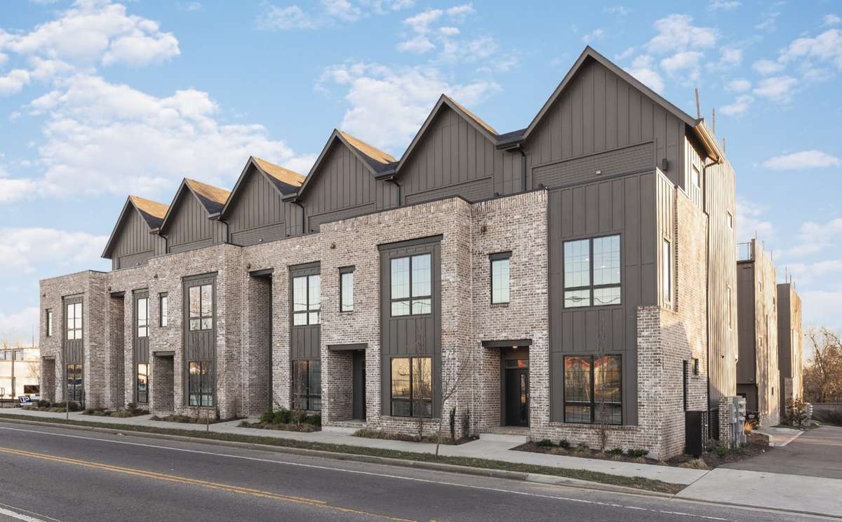 Front facing, brown brick 3 story home + an XL rooftop with Nashville skyline views