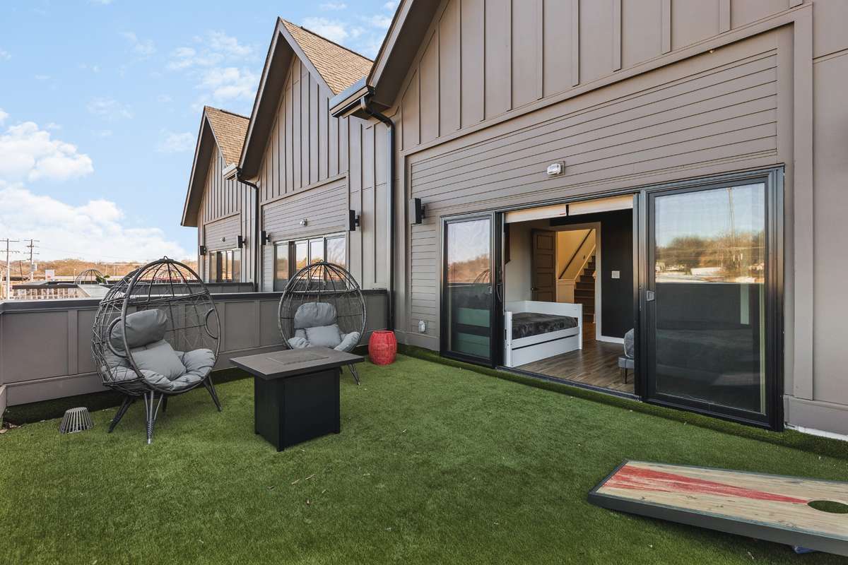 Second level walk out terrace off primary bedroom. One of TWO rooftop terraces