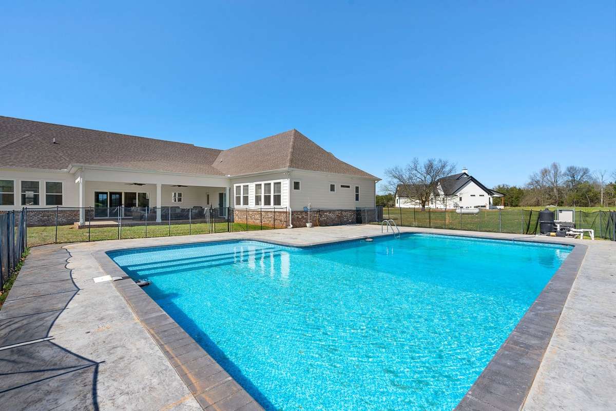 Pool with tons of hang out space and easy access to covered patio.
