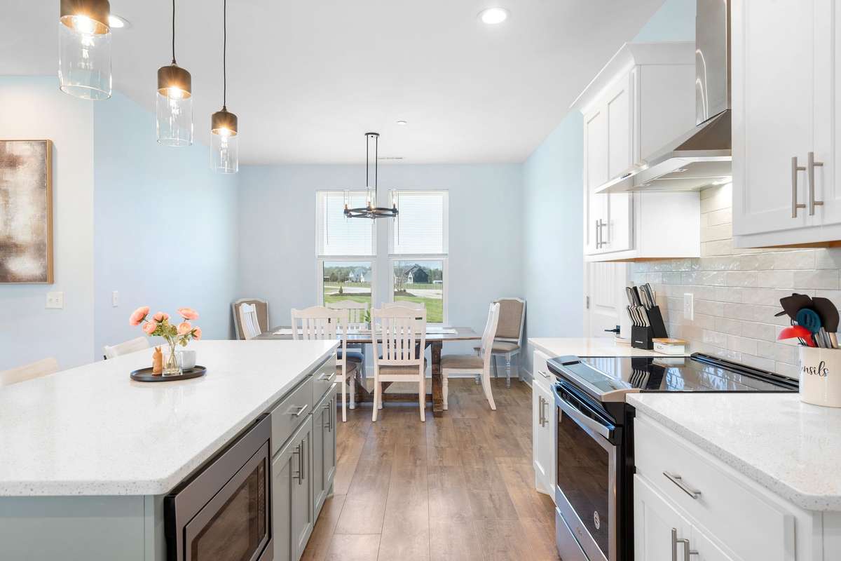 Beautiful kitchen with ample counter space, stylish finishes, and dining area!