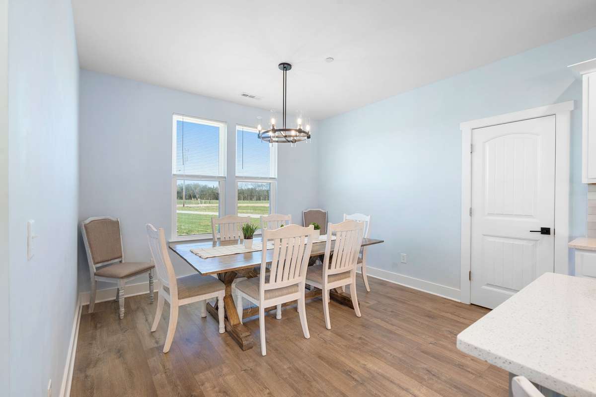 Dining area with large windows, perfect for enjoying meals with natural light!