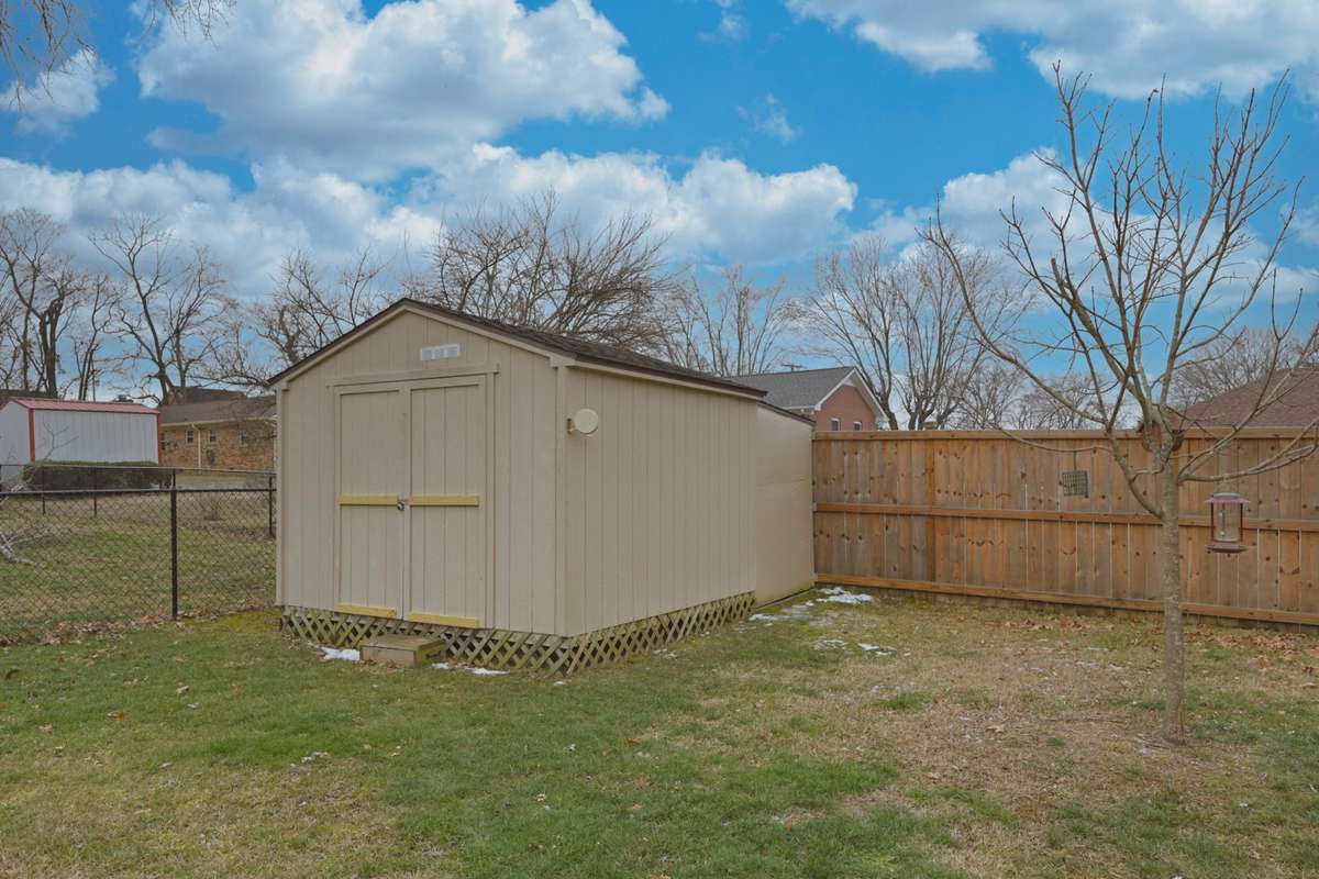 10 X 12 storage barn with a lean-to shed for the lawn mower.