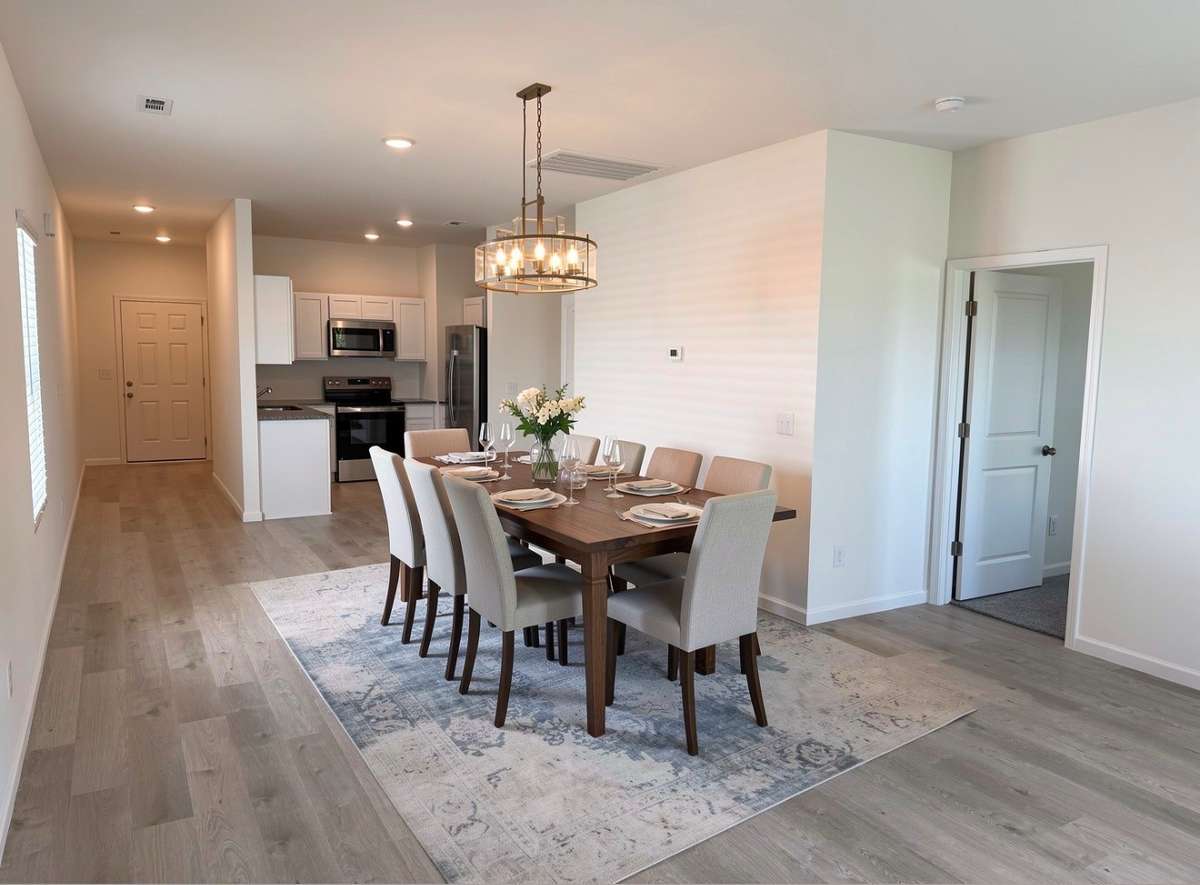 Dining area furniture and lighting is virtual staged