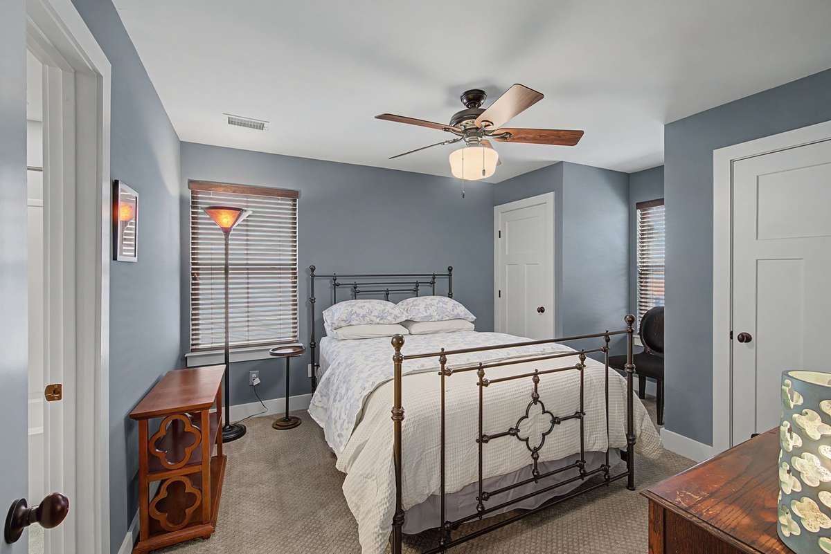 2nd upstairs bedroom with it's on full bathroom and double closets.