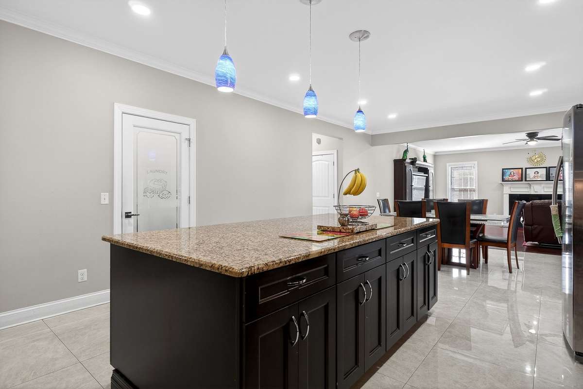 OPEN TO LIVING ROOM FOR EASY ENTERTAINING