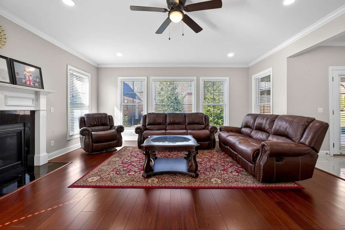 LIVING ROOM WITH HARDWOOD FLOORING & FIREPLACE