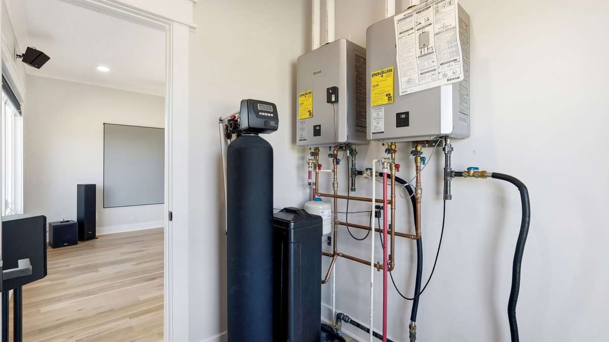 Dual tankless water heater and total home water softner