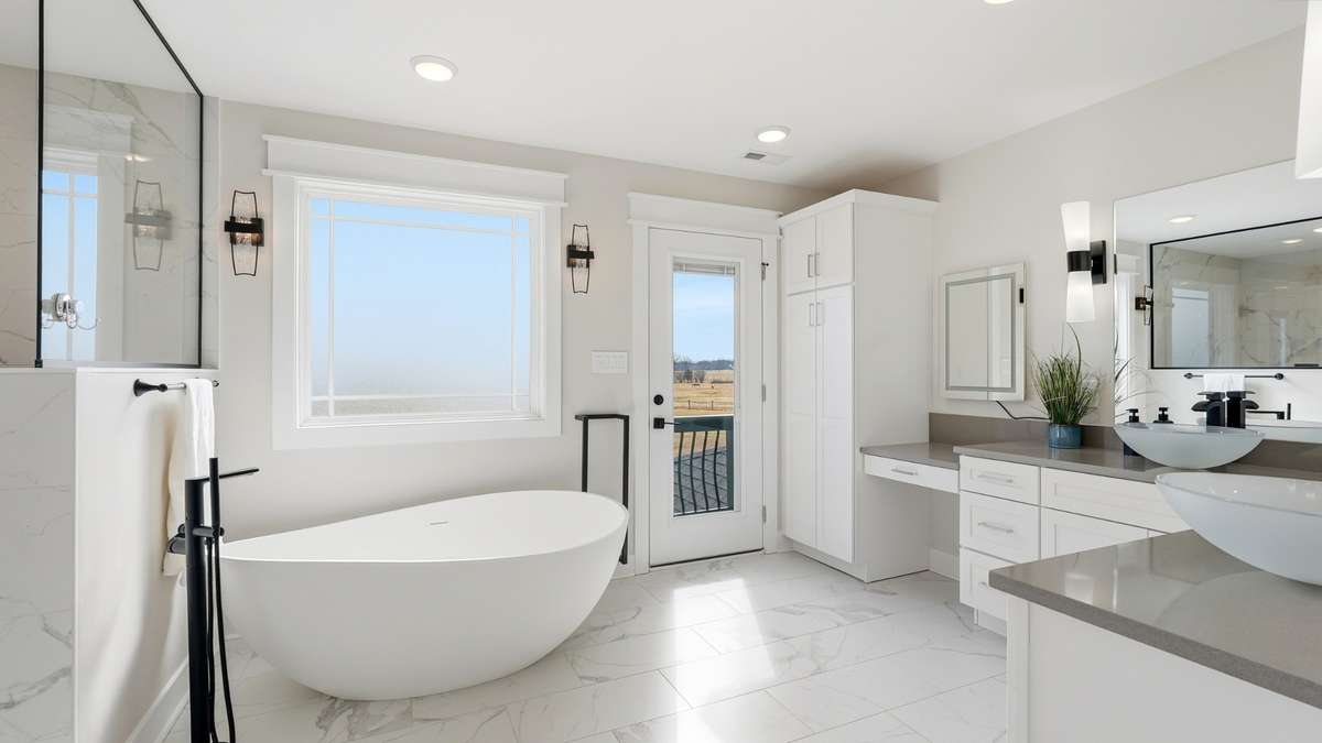 Primary.bathroom with tub, shower and private deck