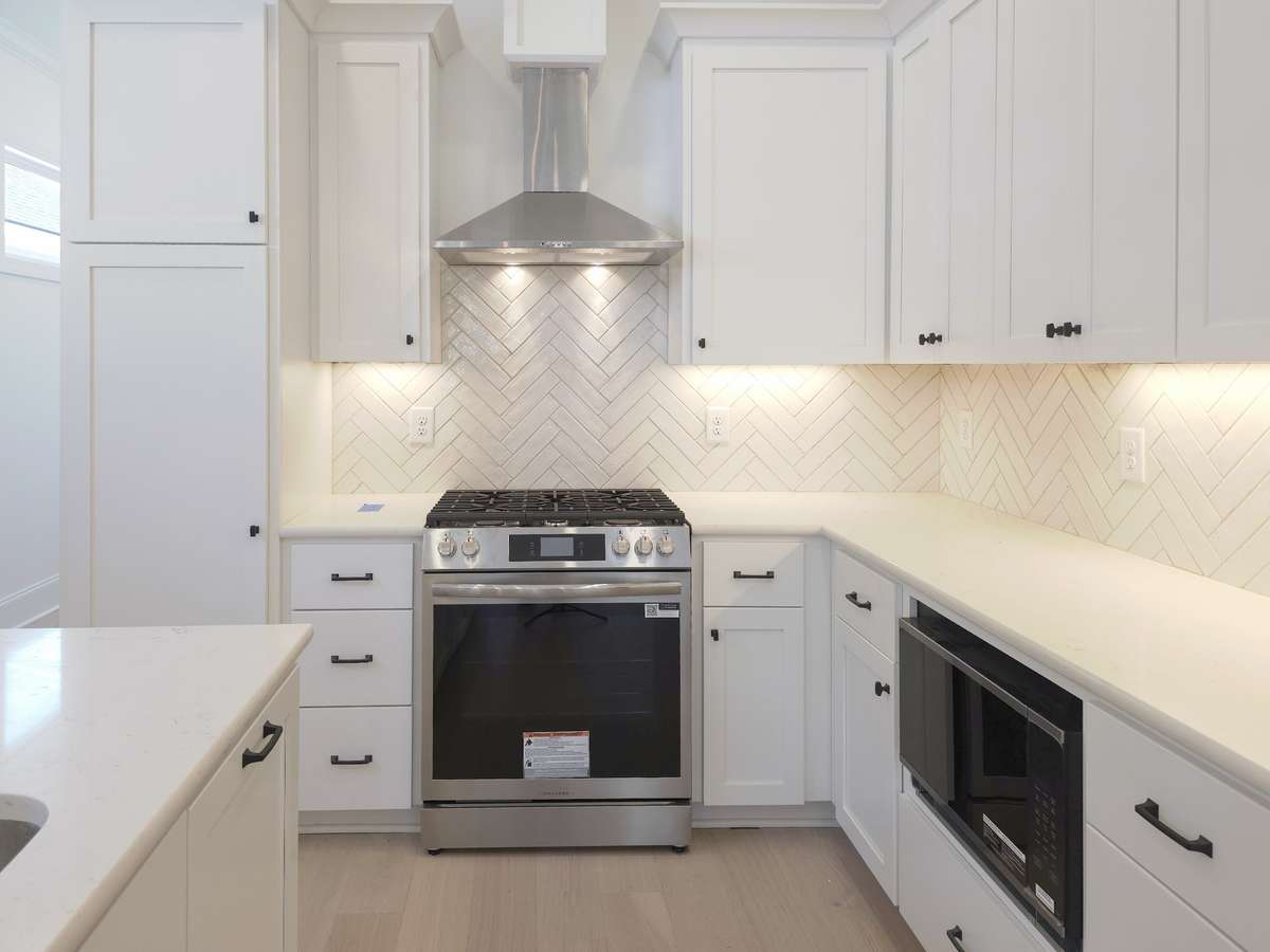 With abundant counter and island space plus plenty of cabinets, this kitchen makes storage effortless while providing plenty of room for cooking, entertaining, and everyday living.