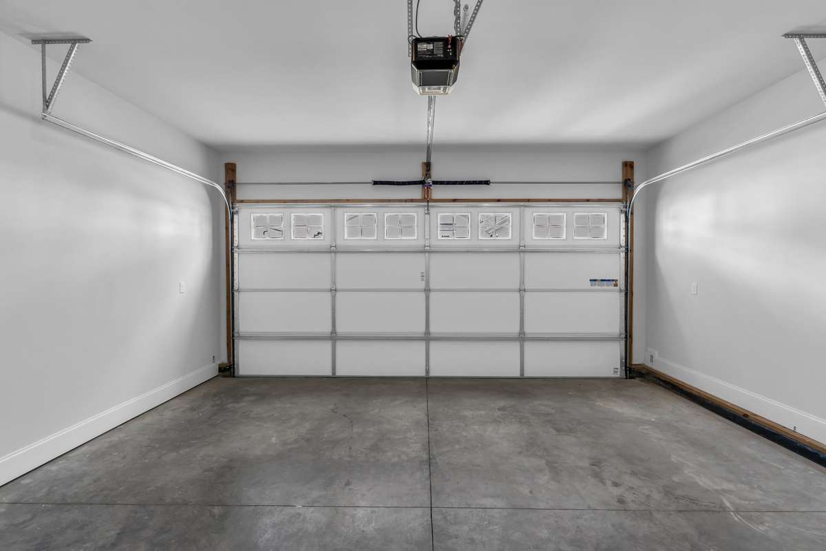 Large, 2-car garage. Keypad entry on the outside, fully insulated door and electric opener. Poplar Plan - This model may differ