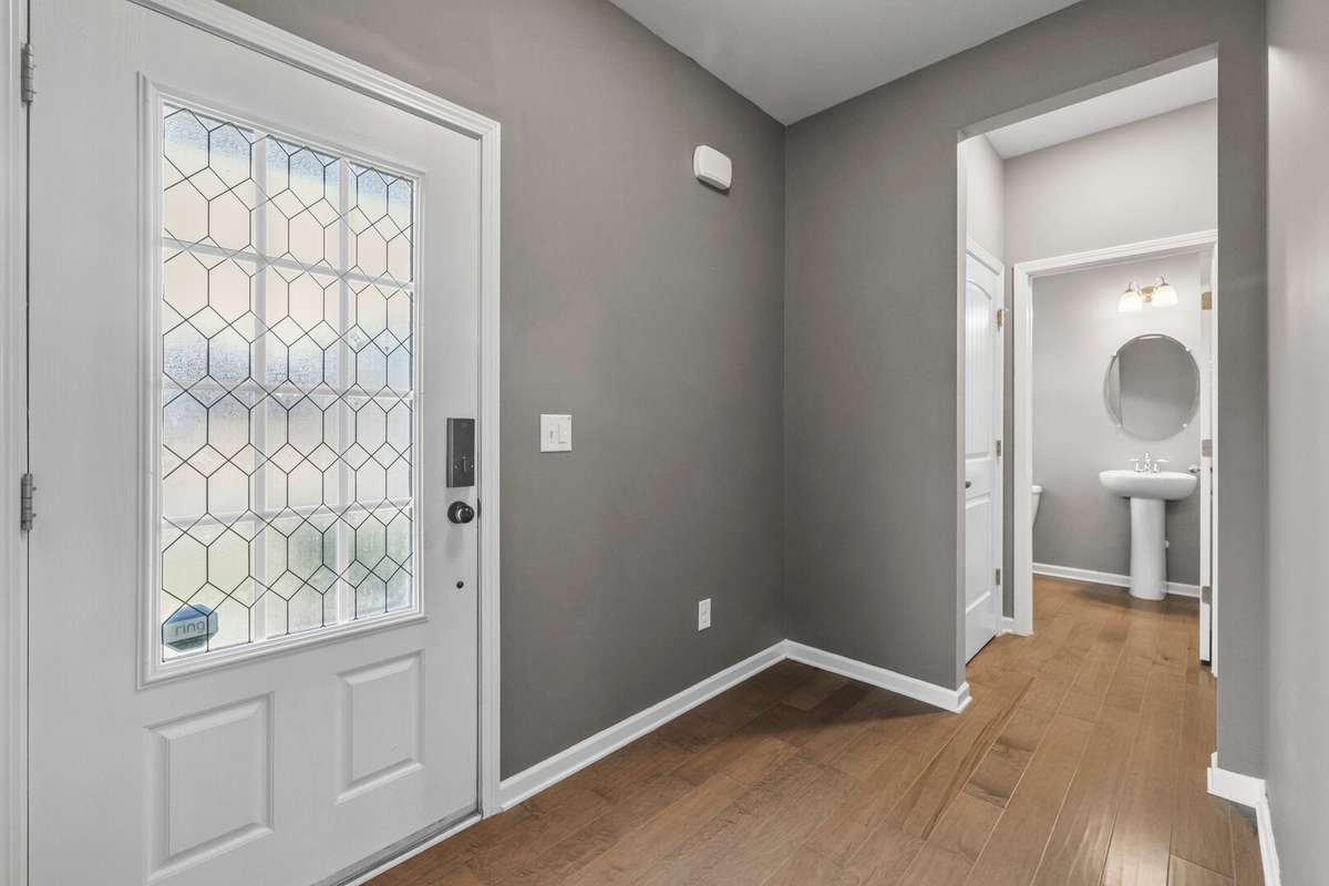 Entry way with private half bath