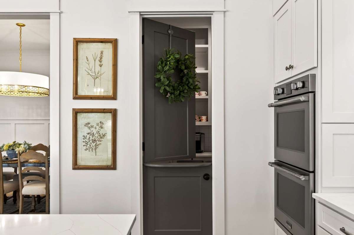 This walk-in pantry offers extra storage, an ice maker and even a cute Dutch door!  This would be perfect if entertaining guest as a serving/bar station for holiday parties and gatherings.