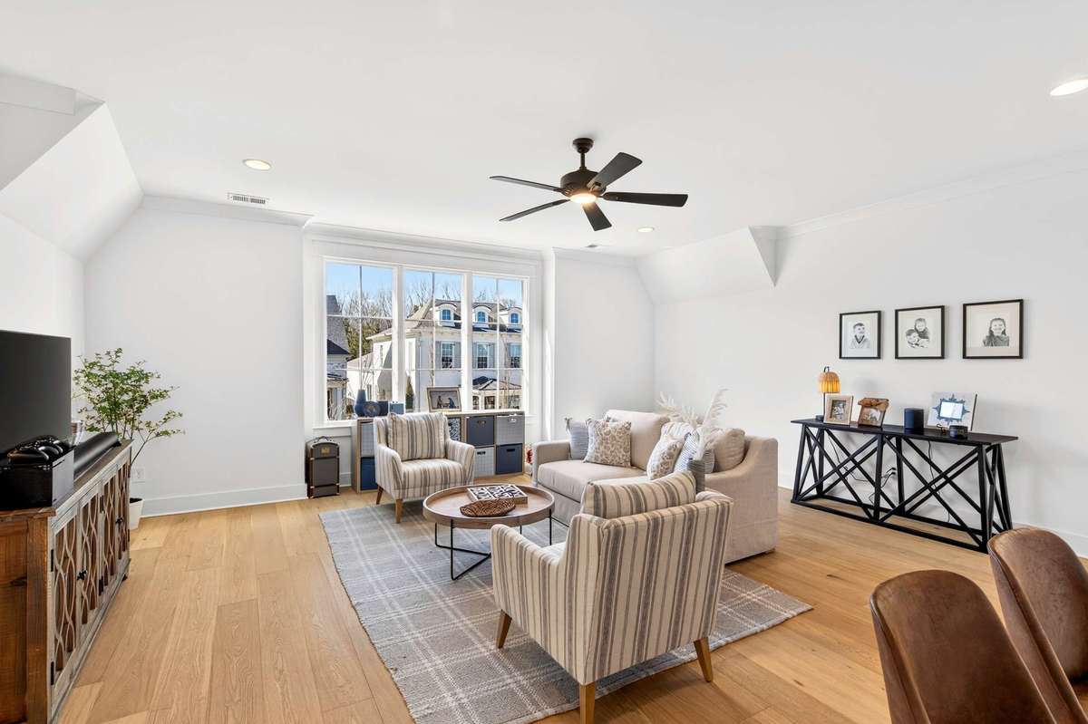 The upstairs bonus room has hardwoods, lots of natural light and additional closet space as well as a half bath for convenience