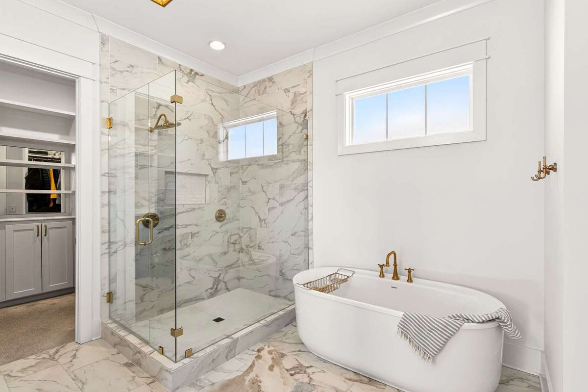 This Primary Bath has separate vanities and a separate tub/shower