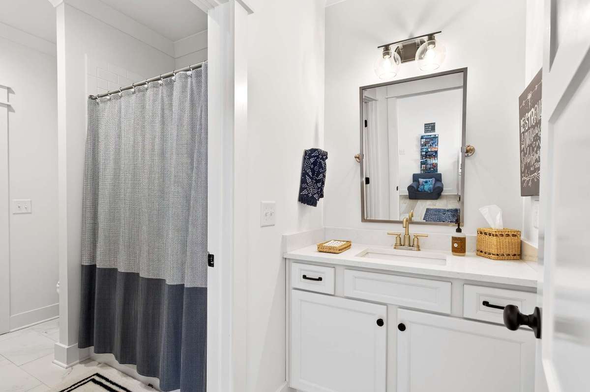 The two upstairs bedrooms are joined by a large Jack & Jill bathroom with separate vanities/sinks