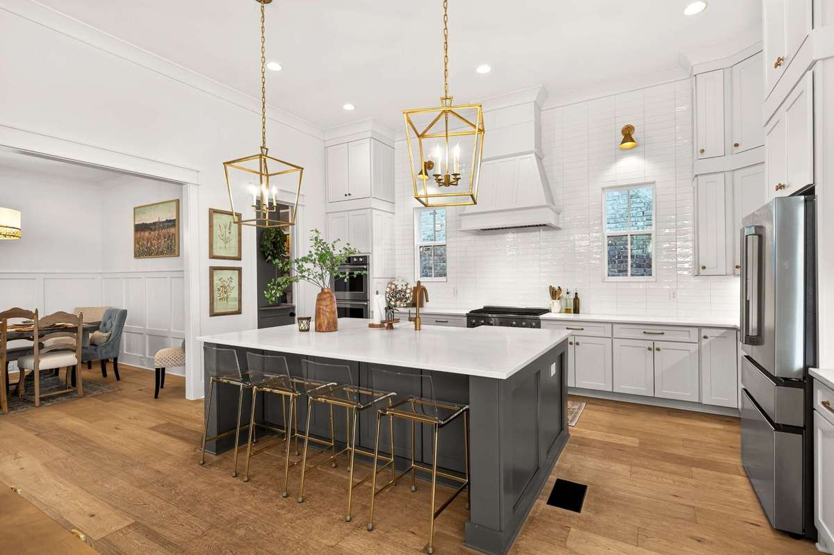 This light, bright kitchen is an entertainer's dream with oversized island and open to the living space or accomodating  large groups