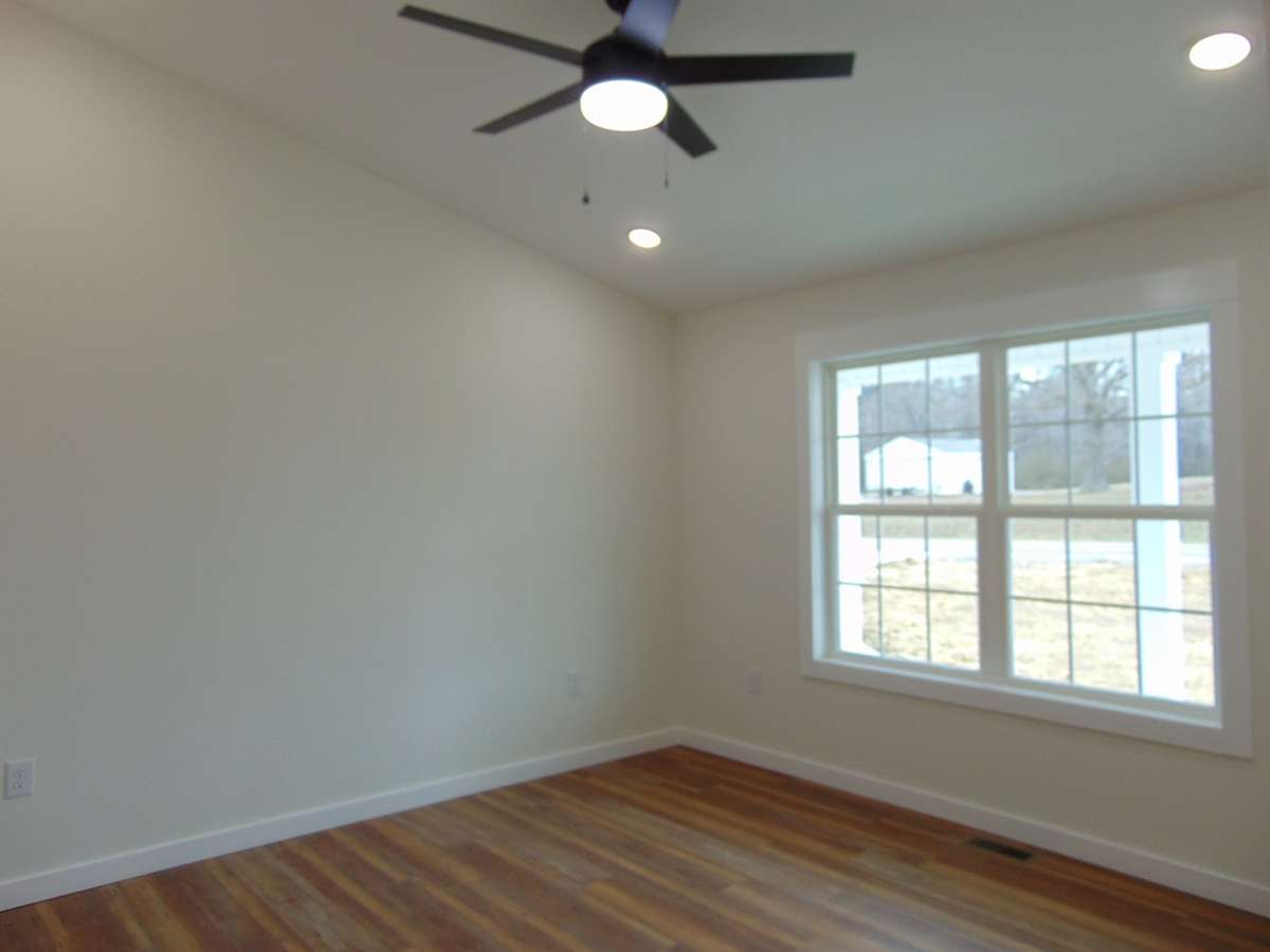 En Suite with tall ceilings, large walk-in closet, double sink vanity, large tiled shower.