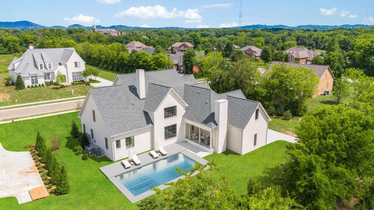 Photo includes a conceptual pool rendering, showcasing the backyard’s potential to accommodate a pool while still offering plenty of outdoor space.