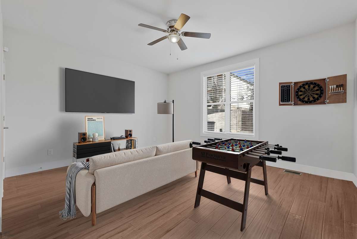 Main Floor Suite | Virtually staged as a game room