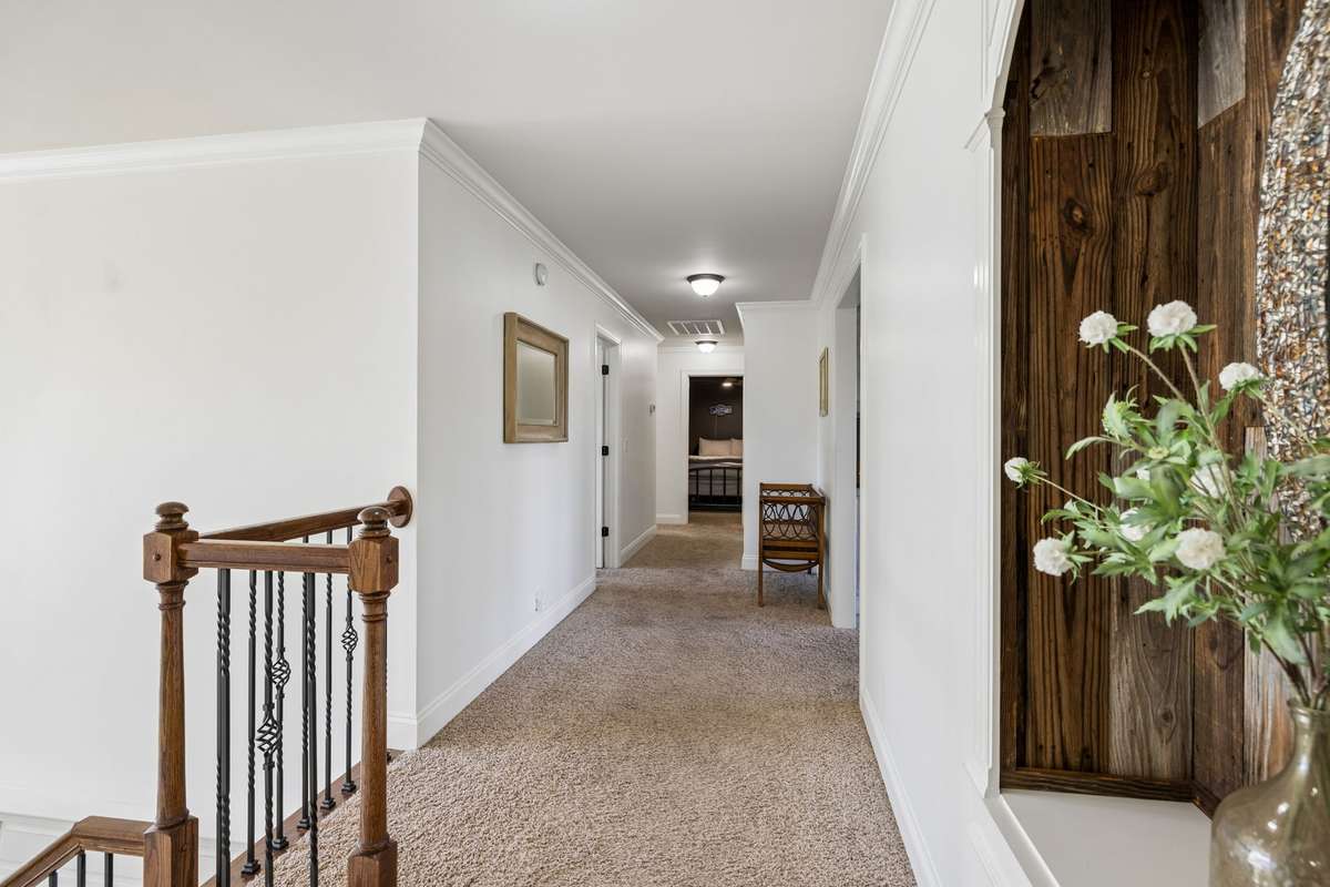Upstairs hallway leading to bonus room and secondary bedrooms