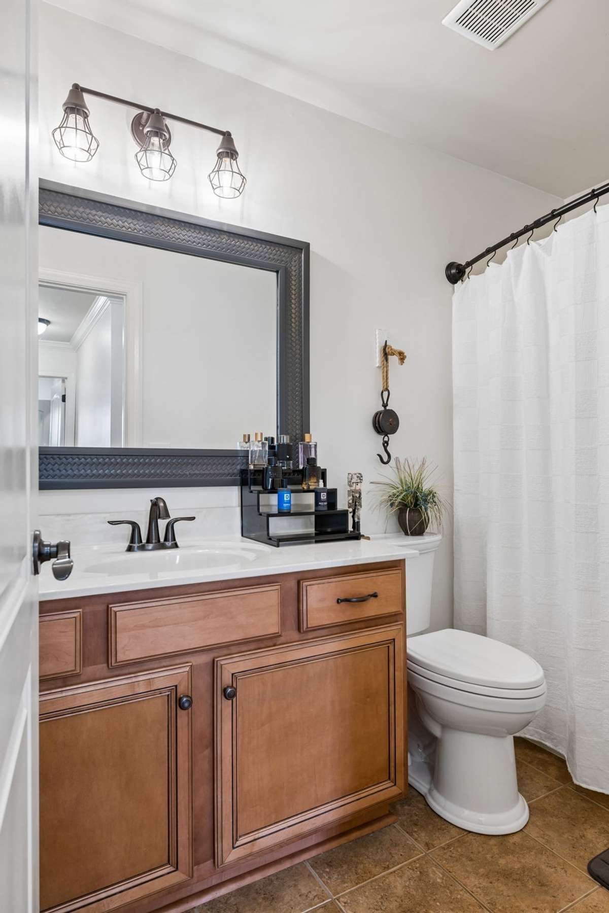 One of two full baths upstairs with two bedrooms sharing this bath