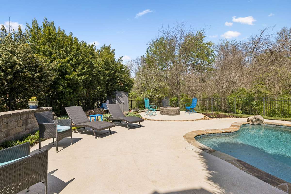 Relax after a long day with the concrete firepit while watching the pool in the privacy of your own backyard - perfect for roasting marshmallows and having smores!