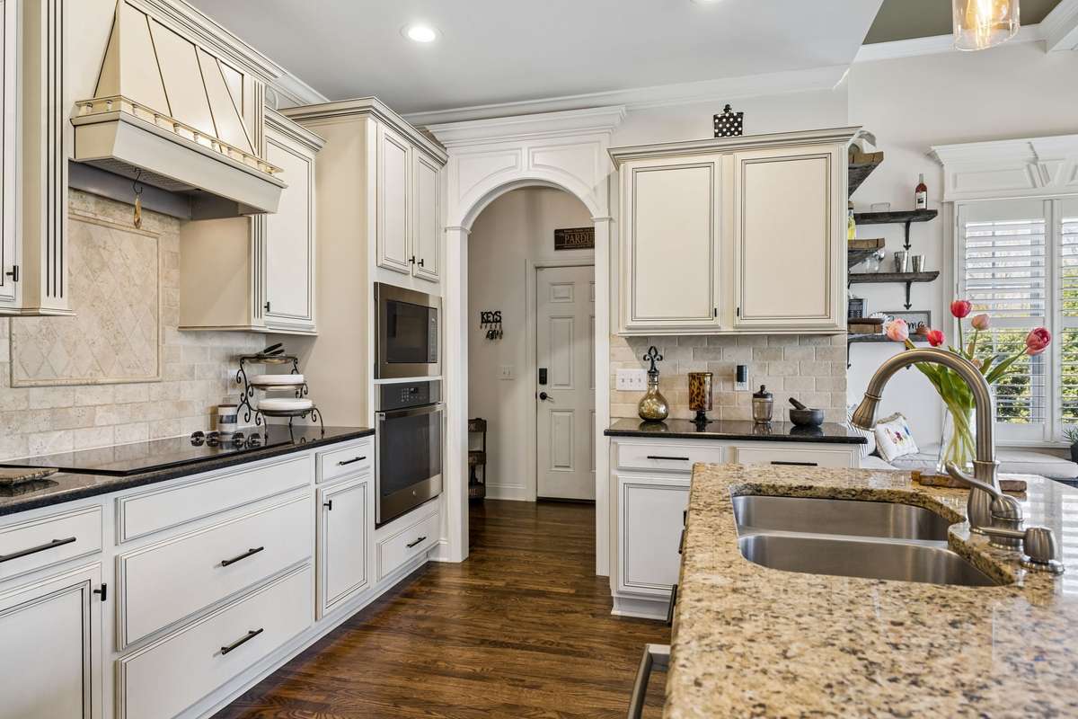 Chef's delight kitchen with stainless appliances and island with eating overhang