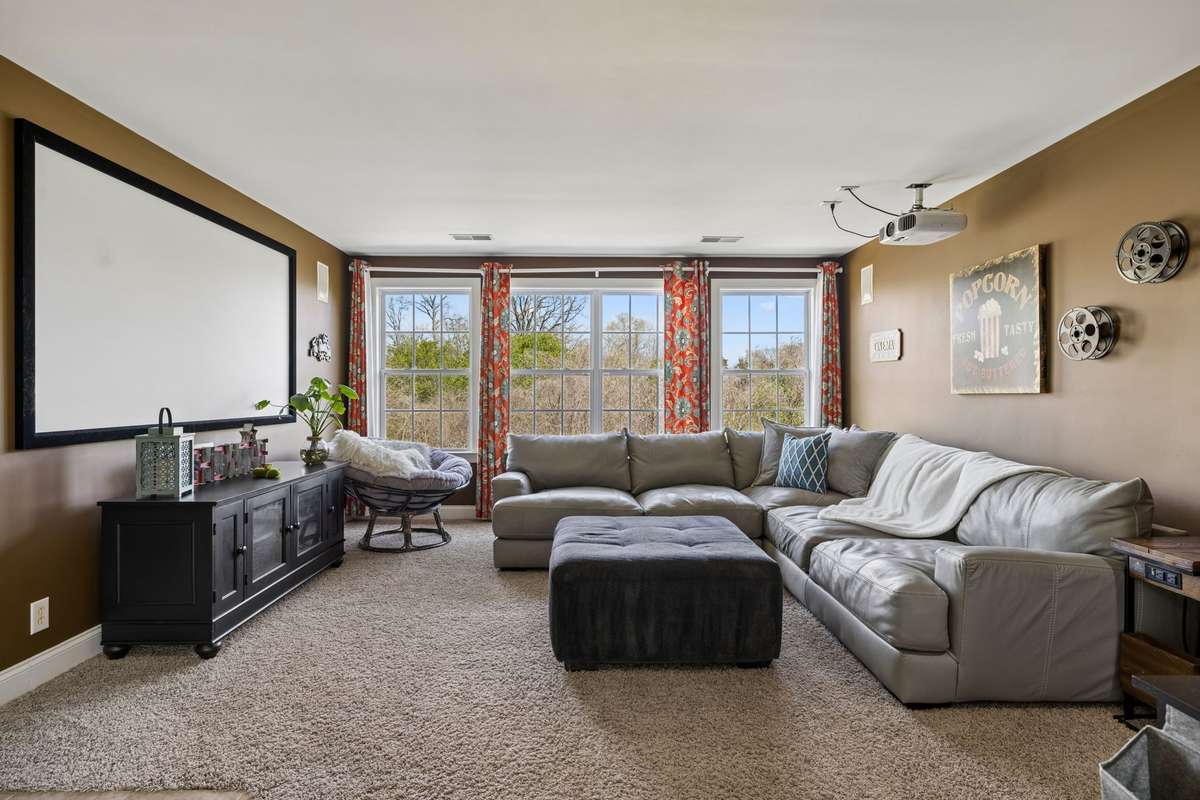 Upstairs includes a bonus or media room with wall of windows overlooking pool and backyard